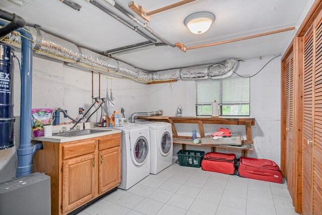 22 Kristy Dr, Bethel, CT 06801 - laundry area featuring washing machine and clothes dryer, cabinet space, and light tile patterned floors