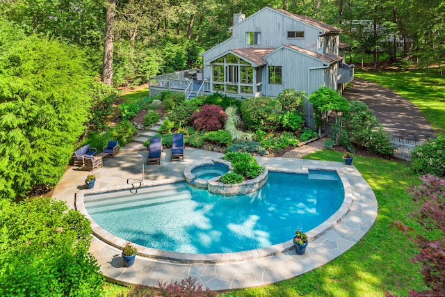 22 Kristy Dr, Bethel, CT 06801 - view of pool featuring a wooden deck, a lawn, a pool with connected hot tub, a patio area, and a wooded view