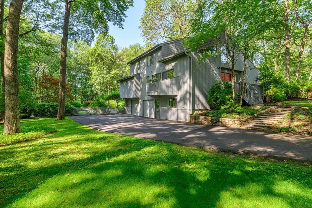 22 Kristy Dr, Bethel, CT 06801 - view of front of house featuring asphalt driveway, an attached garage, a front yard, and stairs