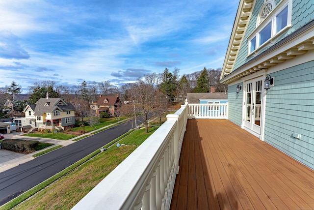 wooden deck with a residential view