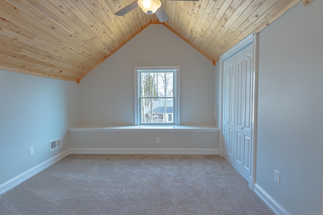 bonus room with ceiling fan, carpet flooring, lofted ceiling, wood ceiling, and baseboards