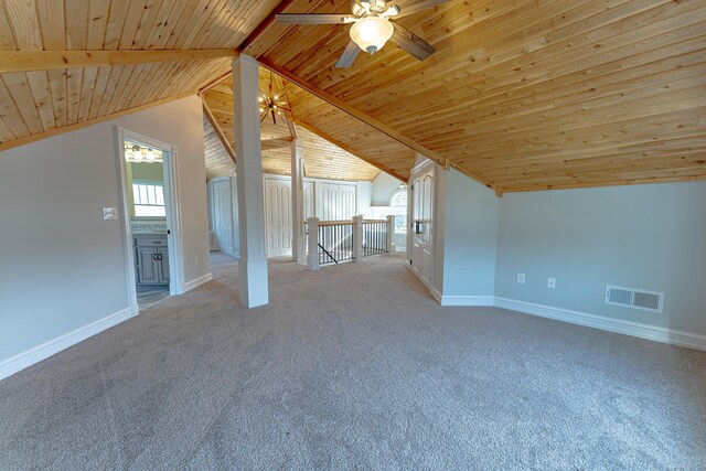 additional living space with wooden ceiling, baseboards, light carpet, and a ceiling fan