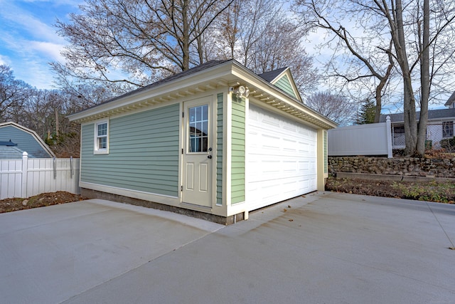 garage featuring fence