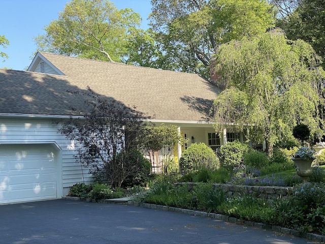 11 Thomas Rd, Westport, CT 06880 - view of front of house with a garage, a shingled roof, and asphalt driveway