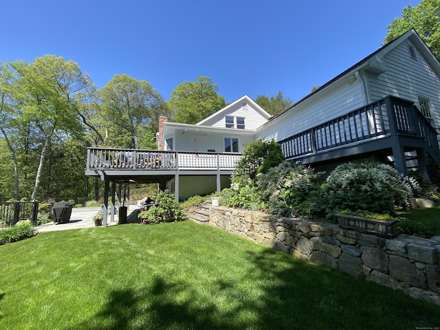 11 Thomas Rd, Westport, CT 06880 - back of house featuring a wooden deck, a yard, and a patio