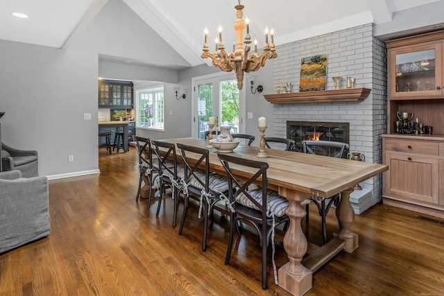 11 Thomas Rd, Westport, CT 06880 - dining area with a fireplace, dark wood-style flooring, a chandelier, baseboards, and recessed lighting