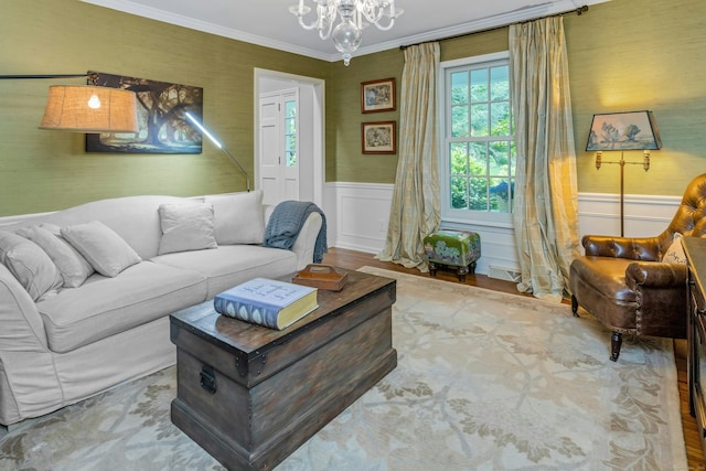 11 Thomas Rd, Westport, CT 06880 - living area featuring a chandelier, crown molding, a wainscoted wall, and wallpapered walls