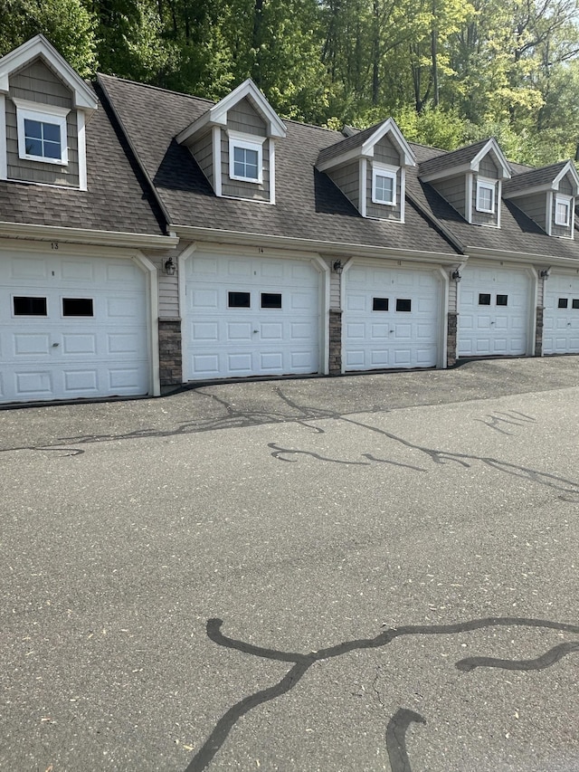 95 S Ridge Ln Unit D201, Berlin, CT 06037 - garage with view of wooded area