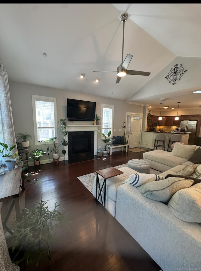 95 S Ridge Ln Unit D201, Berlin, CT 06037 - living room with a fireplace with flush hearth, lofted ceiling, dark wood-style floors, ceiling fan, and baseboards