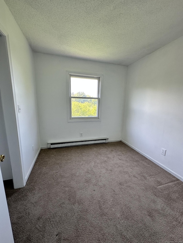 48 Canterbury Dr, Durham, CT 06422 - carpeted spare room with a baseboard heating unit, a textured ceiling, and baseboards