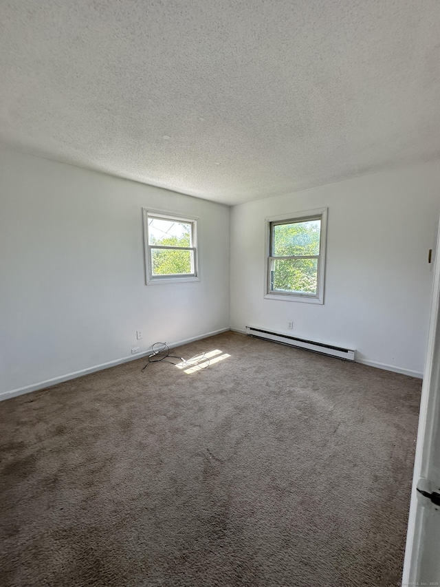 48 Canterbury Dr, Durham, CT 06422 - unfurnished room with baseboard heating, a textured ceiling, carpet, and baseboards