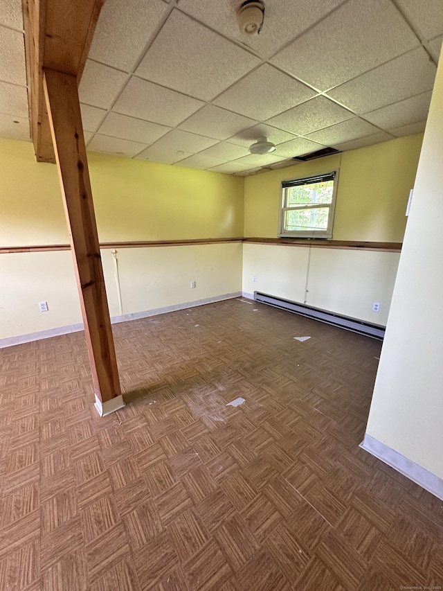 48 Canterbury Dr, Durham, CT 06422 - empty room featuring a baseboard radiator, baseboards, a paneled ceiling, and a smoke detector