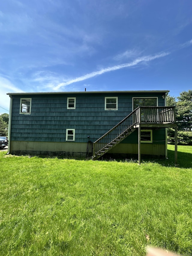 48 Canterbury Dr, Durham, CT 06422 - rear view of property featuring stairs, a deck, and a lawn