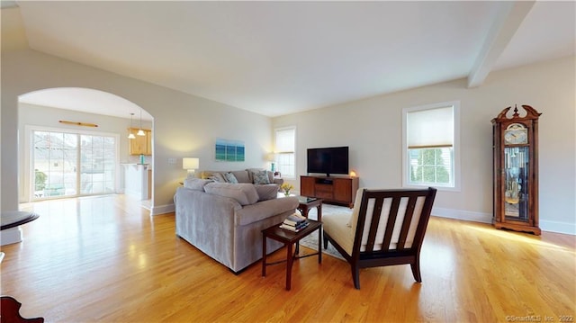 196 Jefferson St, Stratford, CT 06615 - living room with light wood-style floors, healthy amount of natural light, arched walkways, and baseboards