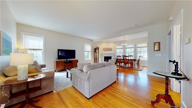 196 Jefferson St, Stratford, CT 06615 - living area featuring light wood-style floors and a chandelier