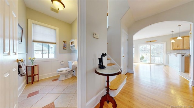 196 Jefferson St, Stratford, CT 06615 - bathroom with toilet, wood finished floors, baseboards, and decorative backsplash