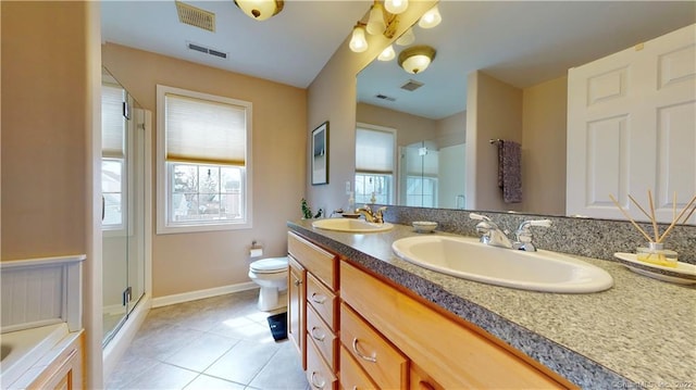 196 Jefferson St, Stratford, CT 06615 - bathroom featuring a stall shower, tile patterned flooring, baseboards, double vanity, and toilet