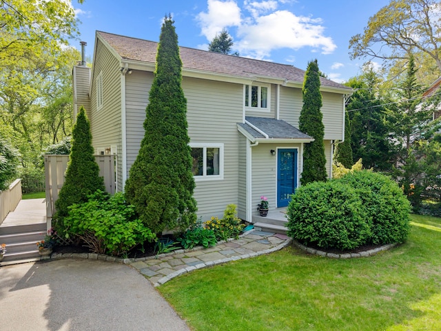 18 Charles St, Groton, CT 06355 - view of front of house featuring a deck, a front yard, and a shingled roof