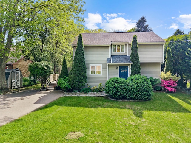 18 Charles St, Groton, CT 06355 - view of front of house featuring a shed, an outdoor structure, and a front yard