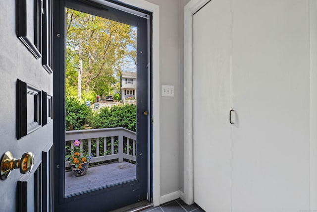 18 Charles St, Groton, CT 06355 - doorway to outside featuring tile patterned flooring and baseboards
