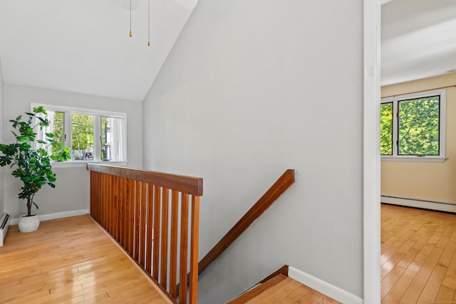 18 Charles St, Groton, CT 06355 - stairway featuring hardwood / wood-style flooring, vaulted ceiling, baseboard heating, and baseboards