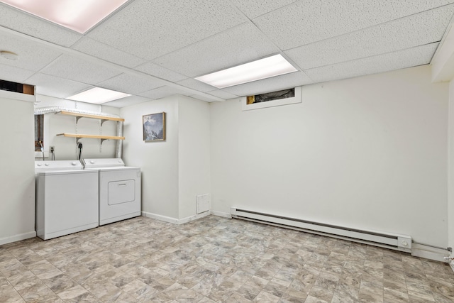 18 Charles St, Groton, CT 06355 - finished basement with a baseboard radiator, washing machine and dryer, a paneled ceiling, and baseboards