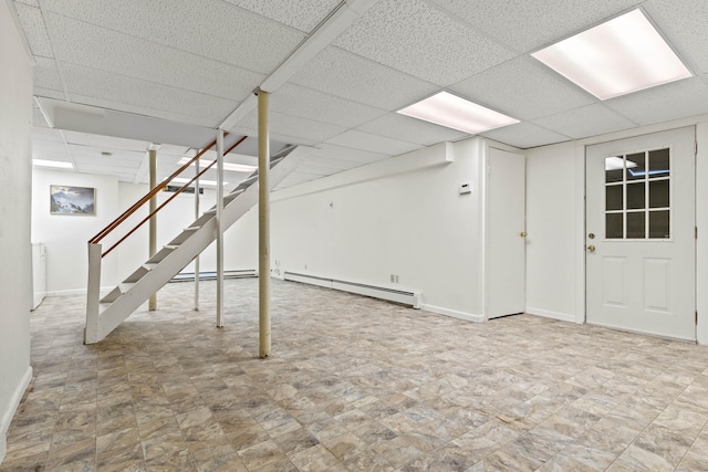 18 Charles St, Groton, CT 06355 - finished basement featuring a baseboard heating unit, a drop ceiling, baseboards, and stairs