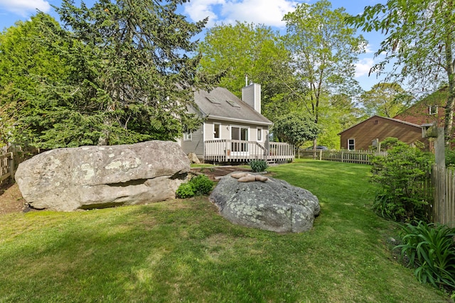 18 Charles St, Groton, CT 06355 - back of house with a chimney and a wooden deck