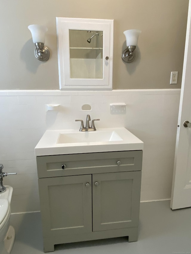 139 Fountain St Apt B9, New Haven, CT 06515 - bathroom featuring tile walls, vanity, toilet, and wainscoting