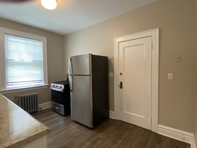 139 Fountain St Apt B9, New Haven, CT 06515 - kitchen with radiator heating unit, stainless steel appliances, dark wood-style flooring, light countertops, and baseboards