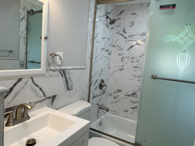 bathroom featuring a sink, toilet, shower / tub combination, and tasteful backsplash