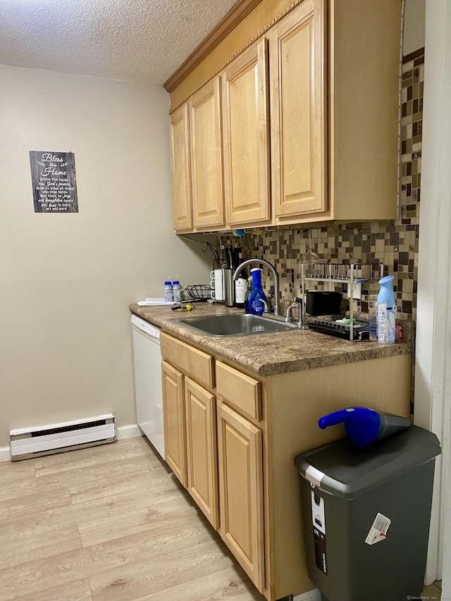 130 Coe Ave Unit 81, East Haven, CT 06512 - kitchen featuring baseboard heating, light brown cabinets, white dishwasher, a sink, and a textured ceiling