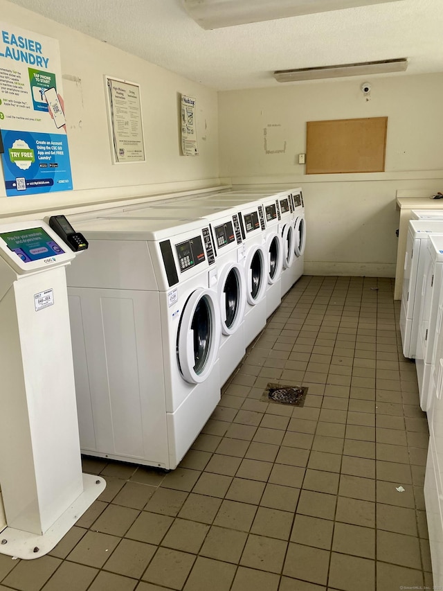 130 Coe Ave Unit 81, East Haven, CT 06512 - shared laundry featuring light tile patterned floors, independent washer and dryer, and a textured ceiling