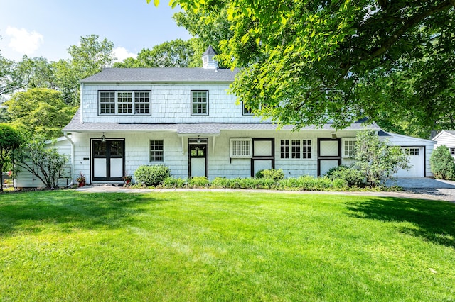 656 Westover Rd, Stamford, CT 06902 - view of front of home featuring a front lawn, roof with shingles, and a garage
