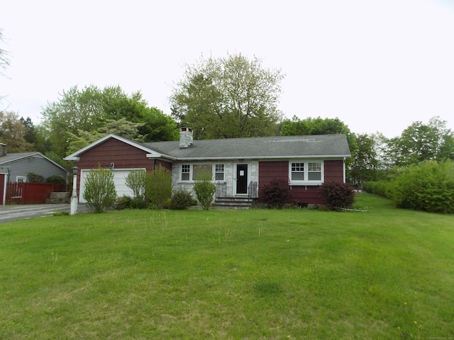 single story home featuring a chimney, a garage, and a front yard