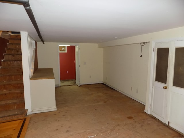 finished below grade area featuring stairs