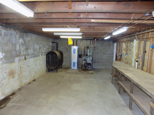 unfinished below grade area with heating fuel, water heater, and a heating unit