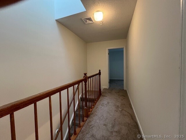 346 Prospect Ave Unit 3, New Haven, CT 06512 - hallway featuring carpet, baseboards, a textured ceiling, and an upstairs landing