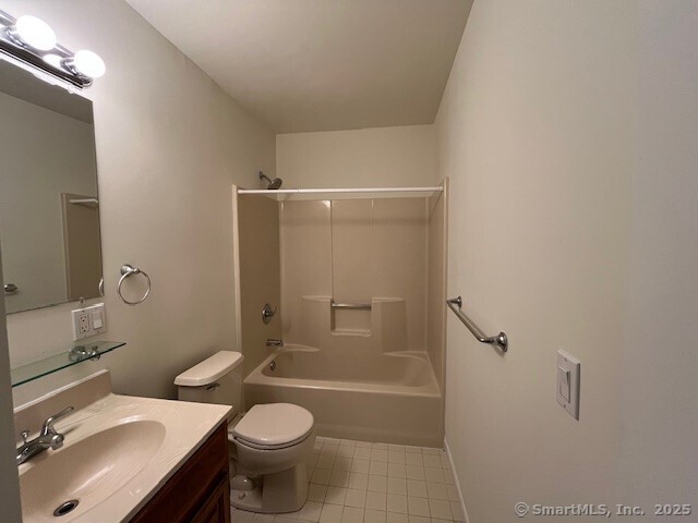 346 Prospect Ave Unit 3, New Haven, CT 06512 - bathroom featuring tile patterned floors, toilet, vanity, and washtub / shower combination