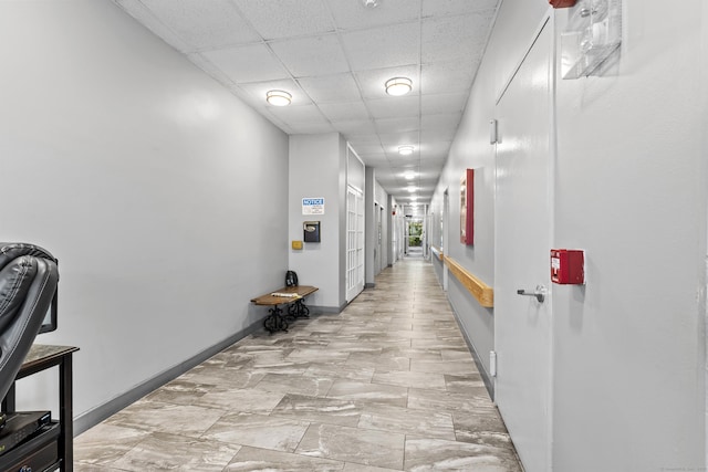 2370 N Ave Unit 12G, Bridgeport, CT 06604 - hall featuring a paneled ceiling and baseboards