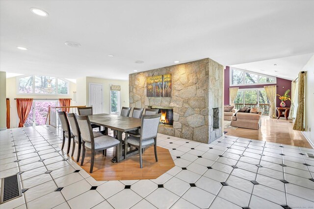 81 Georges Ln, Monroe, CT 06468 - dining space with a stone fireplace, recessed lighting, and light tile patterned floors