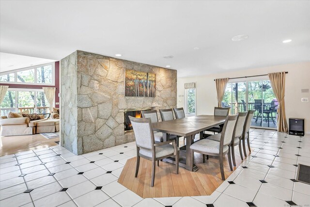 81 Georges Ln, Monroe, CT 06468 - dining area featuring a fireplace, recessed lighting, and light tile patterned flooring