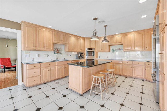 81 Georges Ln, Monroe, CT 06468 - kitchen with light brown cabinetry, a sink, double oven, a center island, and recessed lighting