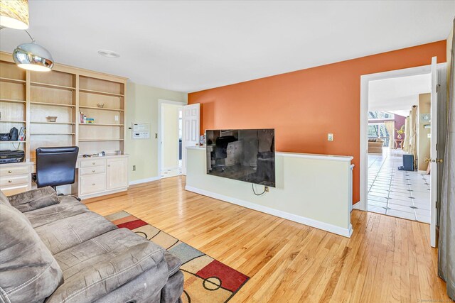 81 Georges Ln, Monroe, CT 06468 - living room with light wood finished floors, baseboards, and an office area