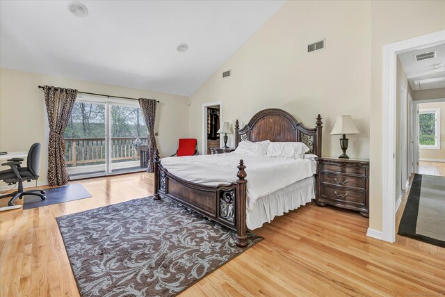 81 Georges Ln, Monroe, CT 06468 - bedroom with access to exterior, wood finished floors, multiple windows, high vaulted ceiling, and baseboards