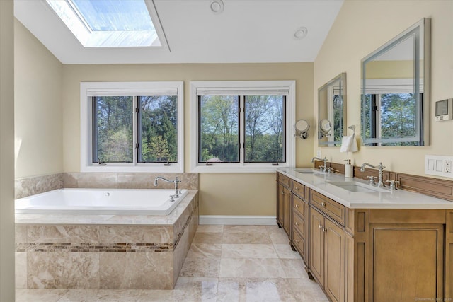 81 Georges Ln, Monroe, CT 06468 - bathroom with a bath, a skylight, double vanity, and baseboards