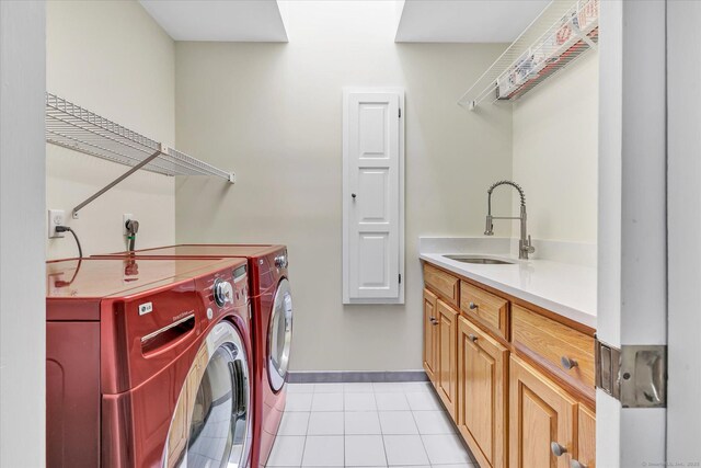 81 Georges Ln, Monroe, CT 06468 - laundry room with washing machine and dryer, light tile patterned floors, baseboards, and cabinet space