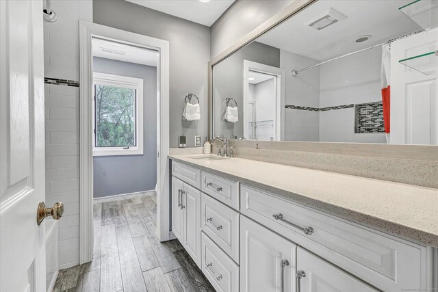 81 Georges Ln, Monroe, CT 06468 - full bath featuring vanity, a shower with curtain, wood finished floors, and baseboards