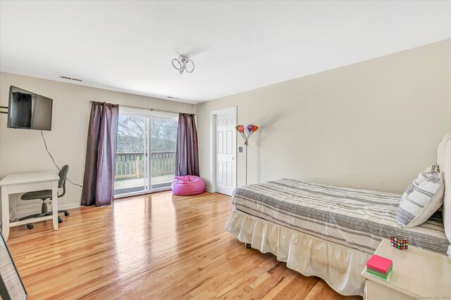 81 Georges Ln, Monroe, CT 06468 - bedroom with light wood-style flooring, access to exterior, and baseboards
