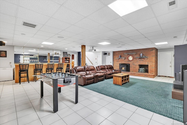 81 Georges Ln, Monroe, CT 06468 - rec room featuring light colored carpet, bar area, a paneled ceiling, and a fireplace